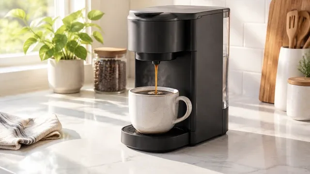 A white mug waits beside a black espresso machine as she pulls one shot, steams and pours at her kitchen counter.