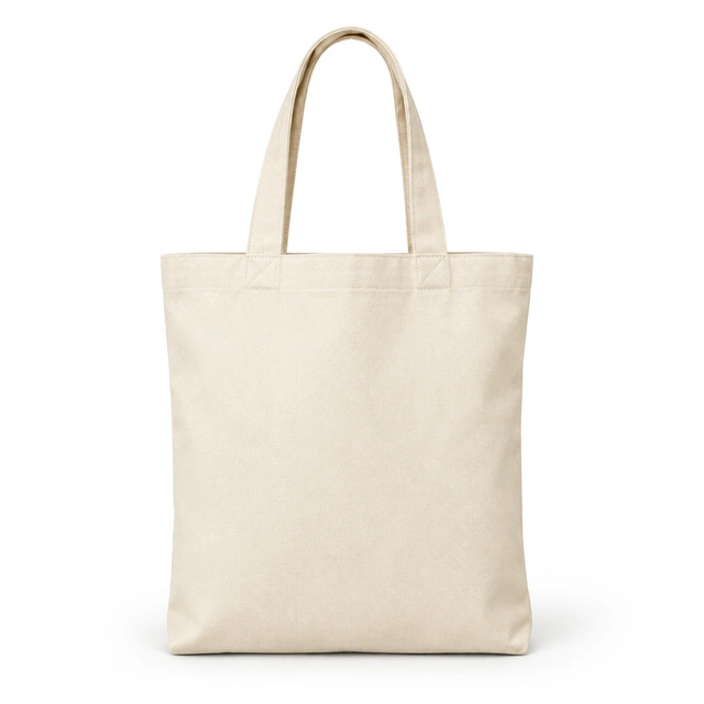 Natural canvas tote bag standing upright on pure white with a soft contact shadow.