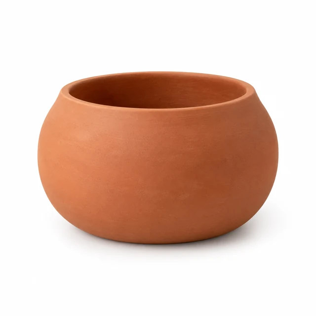 Wide terracotta ceramic planter with an open rim on seamless white.