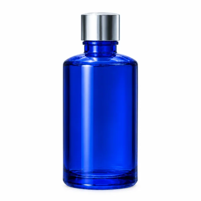A round cobalt-blue glass bottle with a silver cap on a white background.