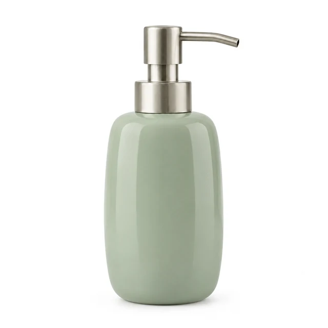 Sage ceramic soap dispenser stands on a clean white background.