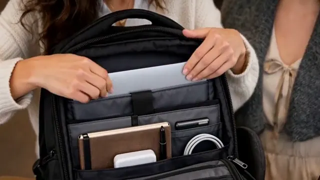 Hands open a black commuter backpack in a cafe, show its compartments, and put it on.