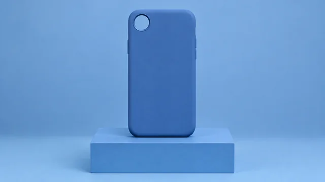 Blue phone case with one small round camera opening on a blue block.