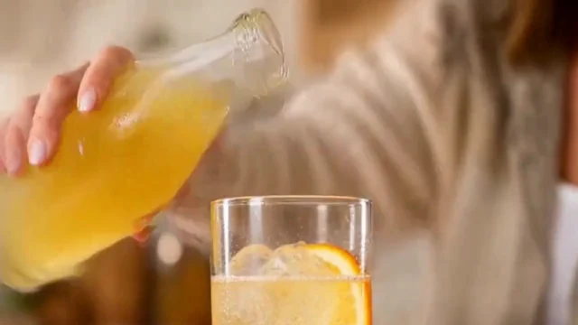 A real landscape frame from the local beverage clip showing citrus drink poured over ice.