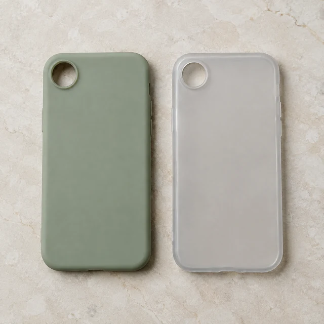 Sage and clear silicone phone cases, each with one round camera opening.