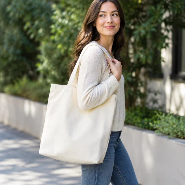 Adult carries a canvas tote