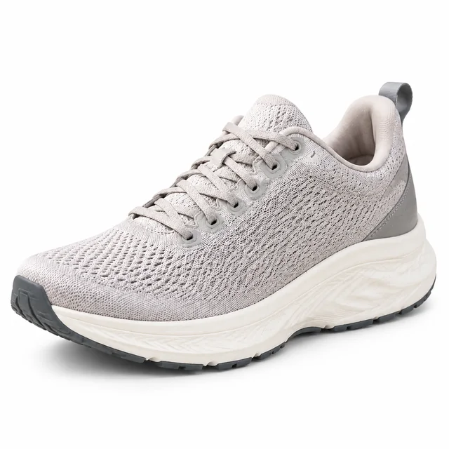 Gray knit running shoe with a cream sole on a pure white background