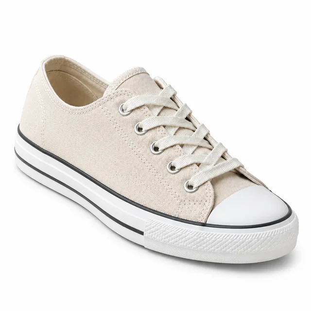 Beige canvas sneaker with a white sole on a pure white background