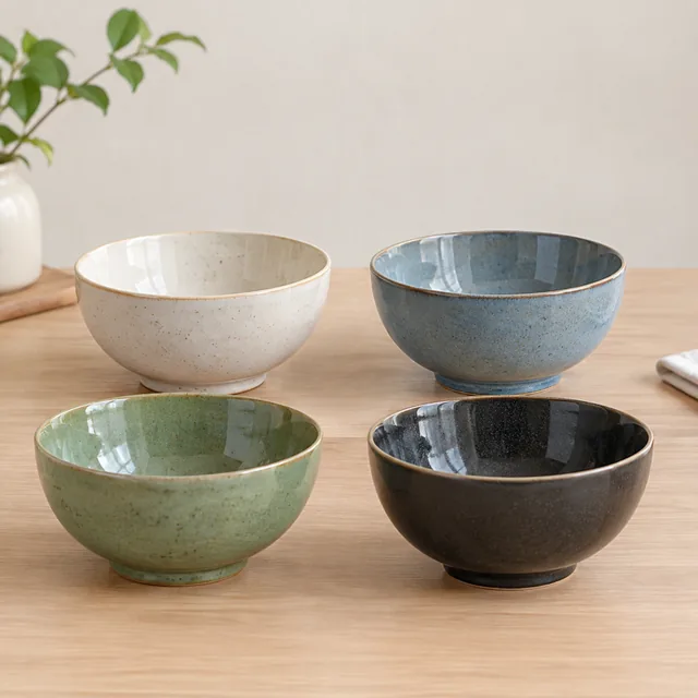 Four ceramic bowls shot from the same height.