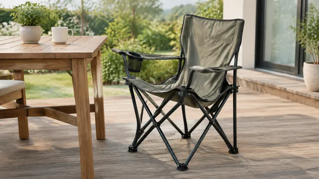 Folding camp chair half open beside a wooden patio table.