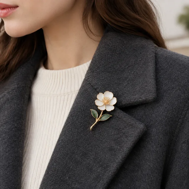 Enamel brooch pinned to a wool coat lapel.