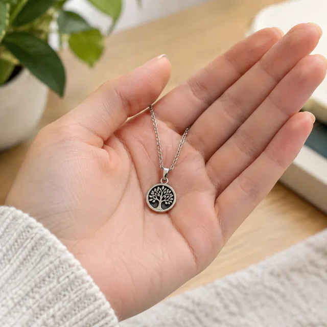 Small pendant resting on an open palm.