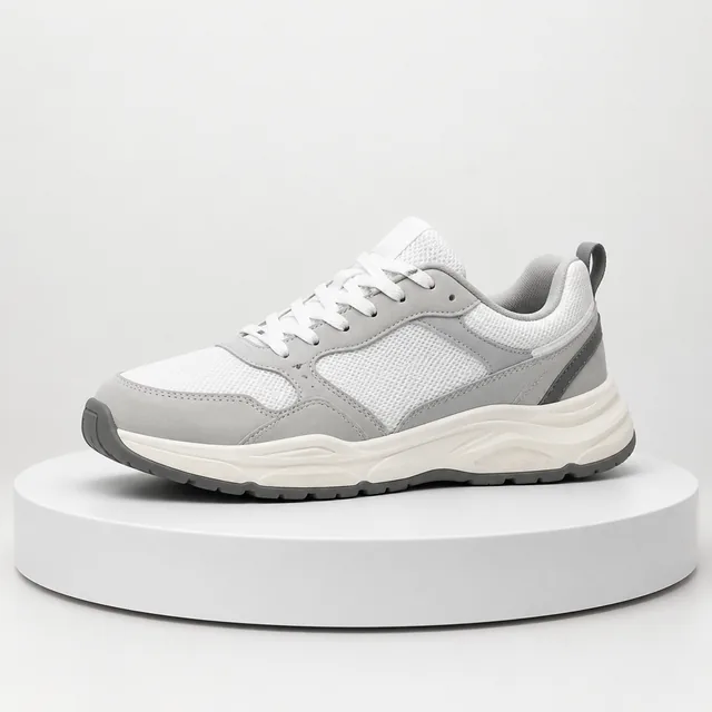 Sneaker turning slowly on a plain turntable.