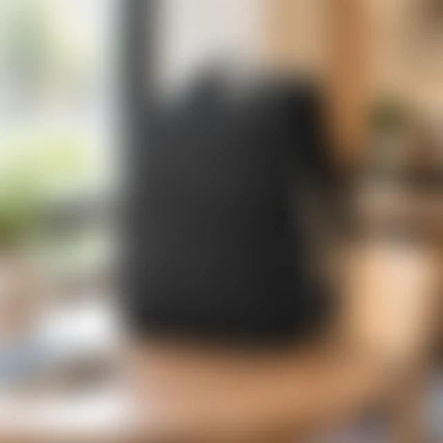 The same black commuter backpack from the clear reference, softened by blur so its pockets and seams are hard to inspect.
