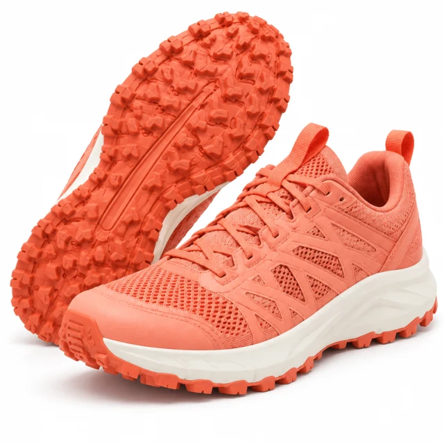 Pair of coral trail shoes with lugged coral outsoles, showing the tread and matching upper.