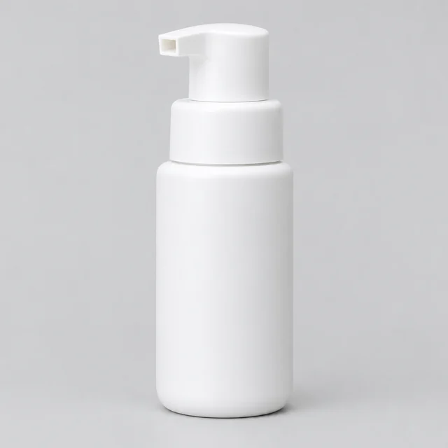 Plain white cleanser pump bottle photographed alone on a light background.