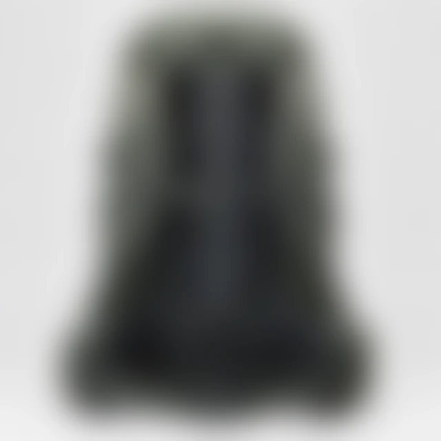 Backpack straps and seams softened by heavy blur.