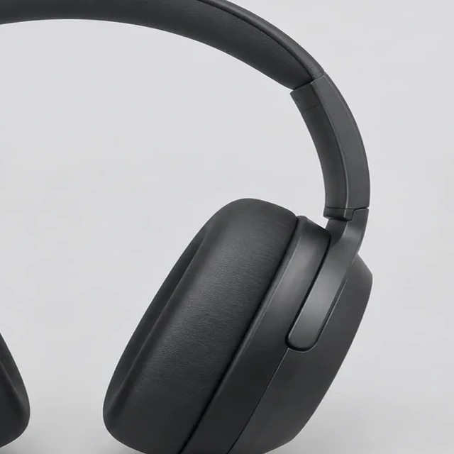 Left headphone ear cup clipped by the frame edge.