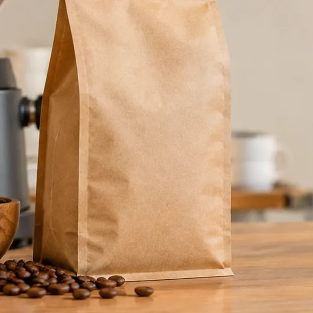 Coffee pouch enlarged until its sealed top leaves the frame.