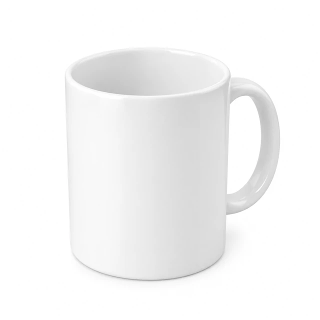 Plain white ceramic mug isolated on white in a three-quarter elevated view with its opening visible.