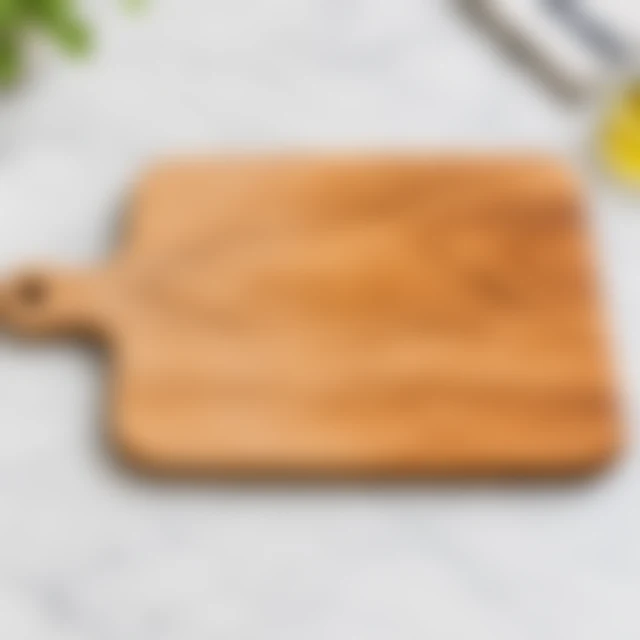 Light wooden cutting board softened out of focus with its handle and outline still discernible.