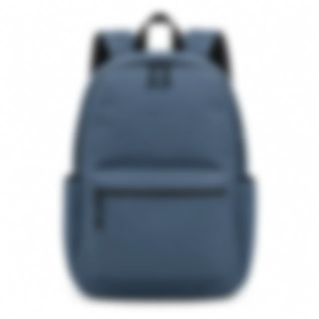 Blue daypack in soft focus on a white background.