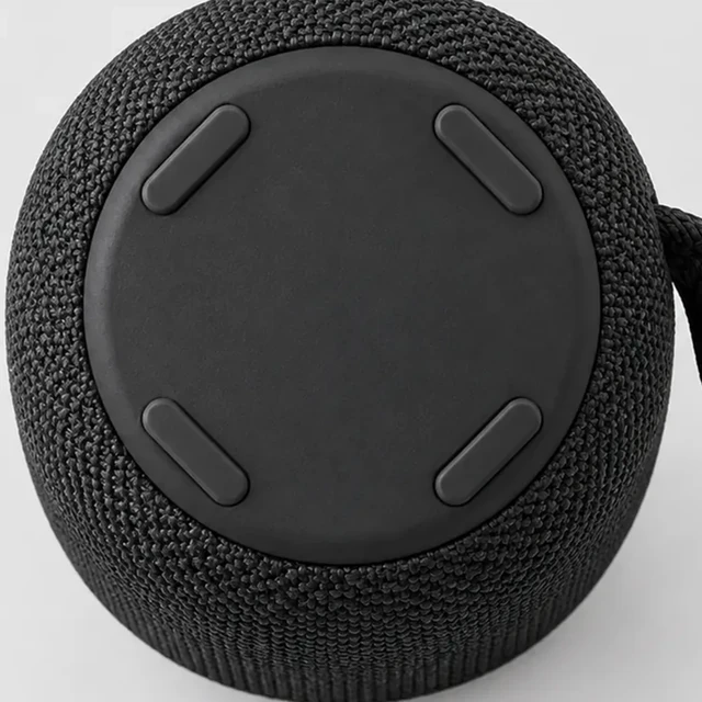 Portable speaker enlarged until part of its rim falls outside the frame.