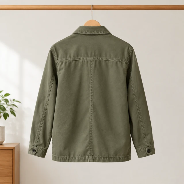 Muted olive field jacket shown from the back, with collar and seam details visible.