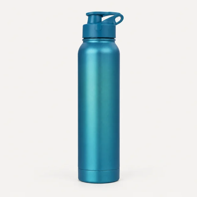 Matte blue water bottle standing alone on a pale studio background.