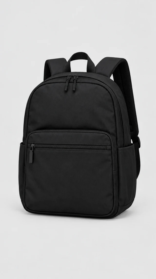 Black commuter backpack shown full length in a vertical studio frame.