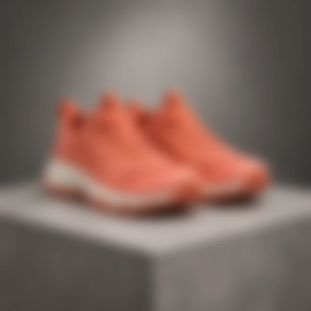 Coral trail shoe softened by blur on a stone display.