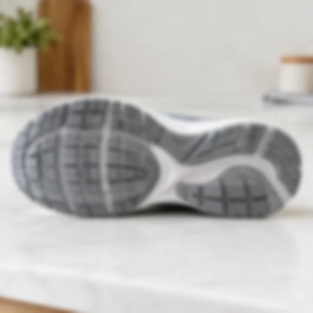 Sneaker outsole tread softly blurred so its texture is hard to inspect.