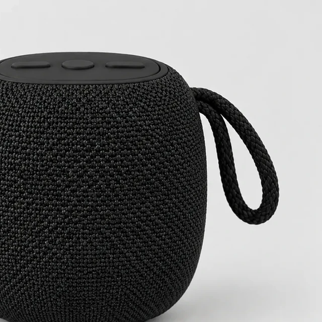 Portable speaker cut off at the left edge by a tight crop.