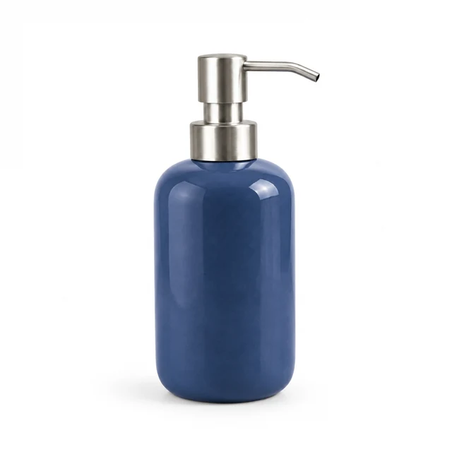 Unbranded ceramic soap dispenser in deep cobalt blue glaze with a brushed metal pump on white.