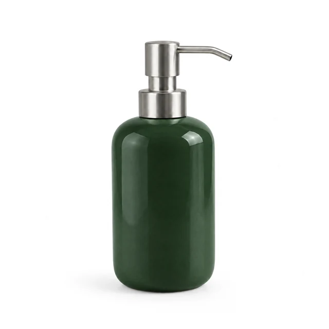 Unbranded ceramic soap dispenser in deep forest green glaze with a brushed metal pump on white.