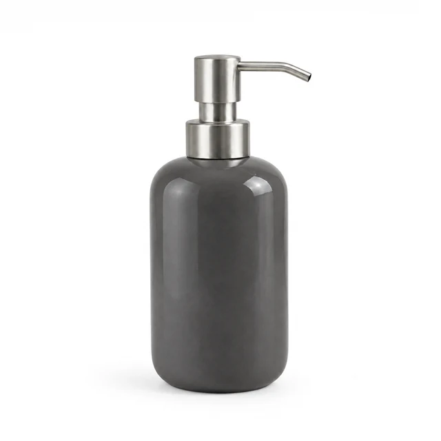 Unbranded ceramic soap dispenser in warm charcoal gray glaze with a brushed metal pump on white.