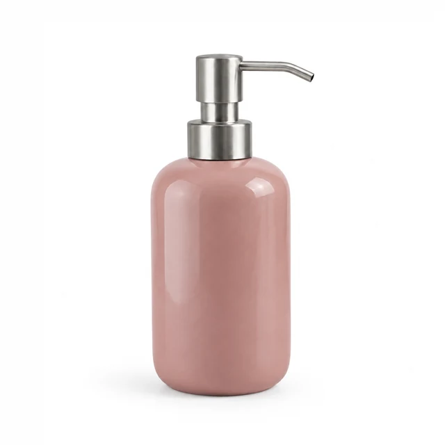 Unbranded ceramic soap dispenser in muted dusty rose glaze with a brushed metal pump on white.