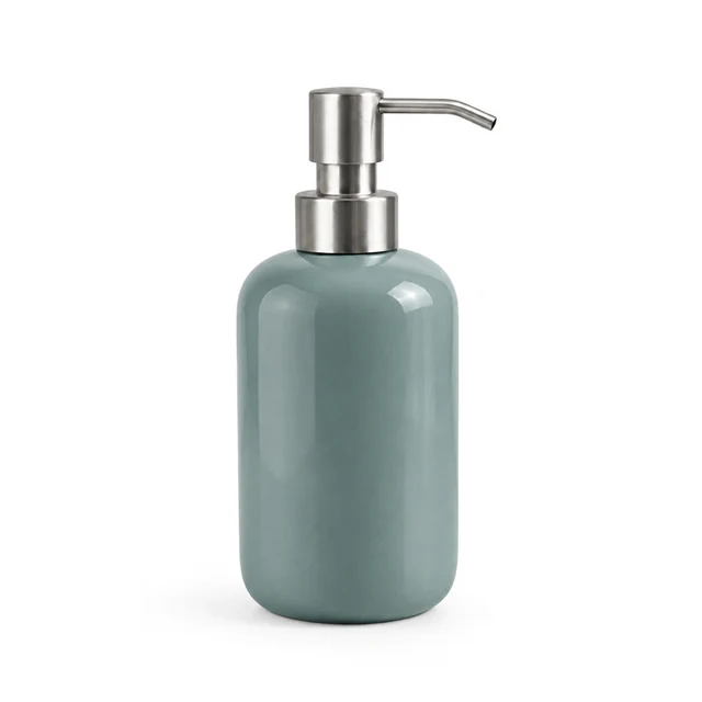 Unbranded ceramic soap dispenser in muted teal glaze with a brushed metal pump on white.