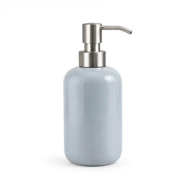 Unbranded ceramic soap dispenser in pale blue-gray glaze with a brushed metal pump on white.