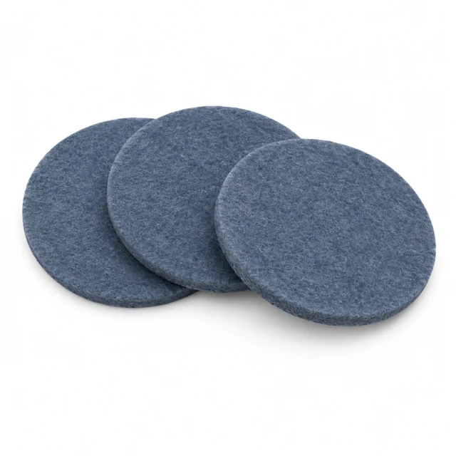 Three slate-blue felt coasters arranged on seamless white.