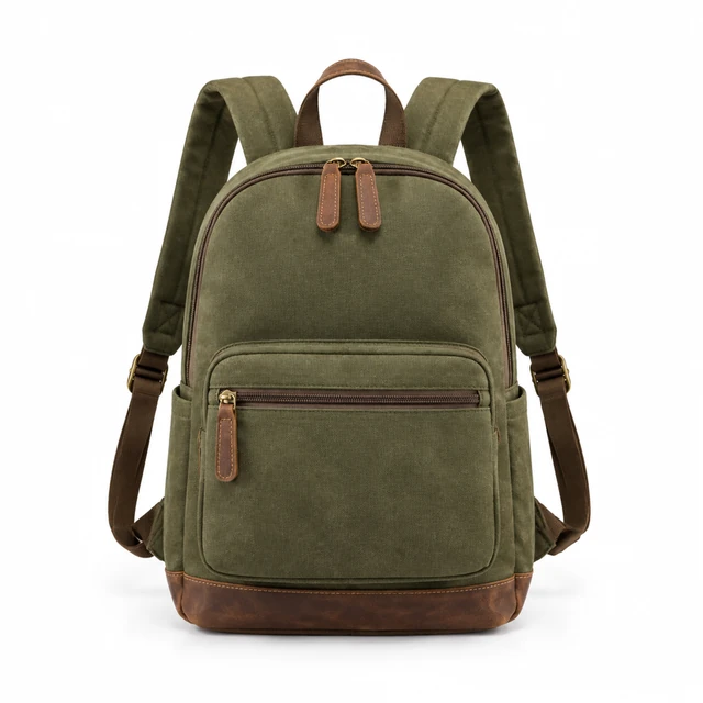 Olive canvas backpack with brown leather trim on seamless white.