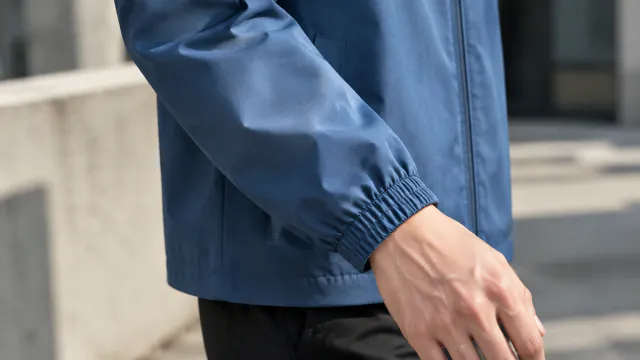 Blue jacket sleeve and cuff detail on a person